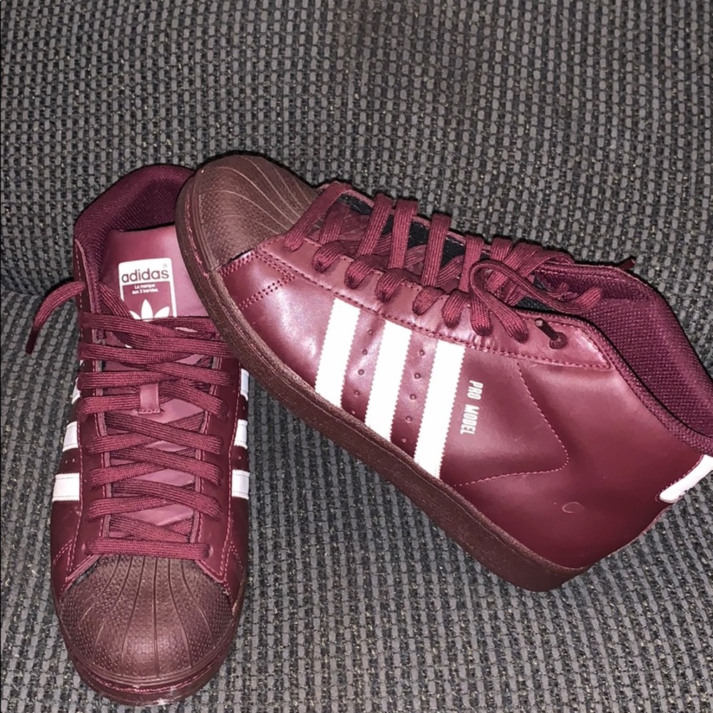 Burgundy shell toe Adidas